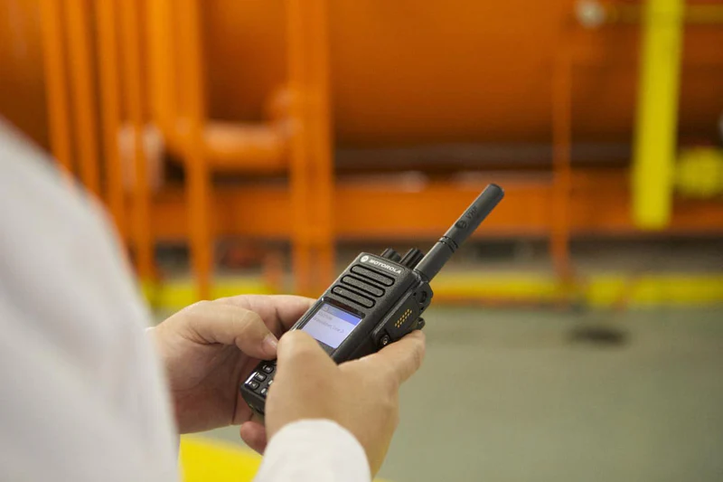 School staff coordinating safety over two-way radios